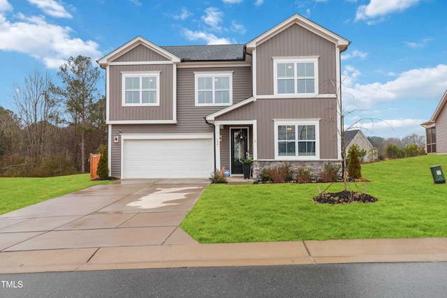 view of front of home featuring a garage and a front lawn