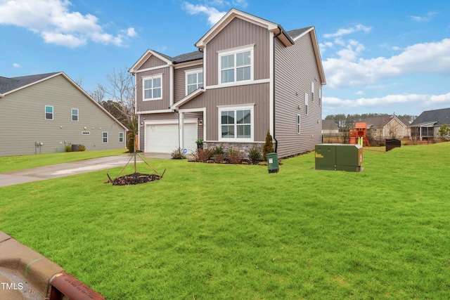 view of front of house with a garage and a front yard