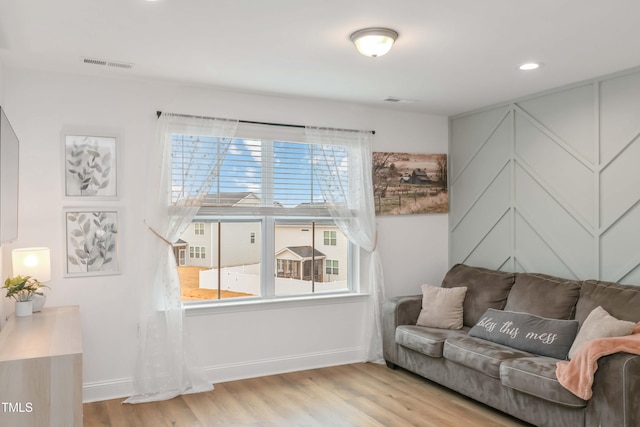 living room with a healthy amount of sunlight and light wood-type flooring