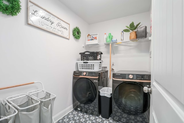 clothes washing area featuring washing machine and clothes dryer