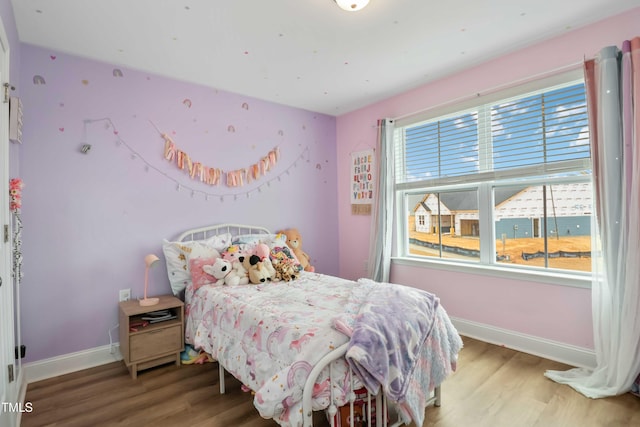 bedroom with wood-type flooring