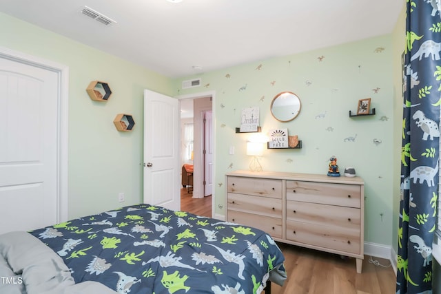 bedroom with light hardwood / wood-style flooring