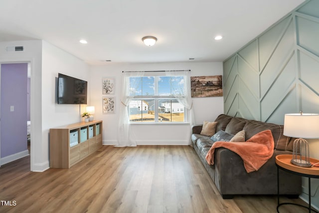 living room with light hardwood / wood-style flooring