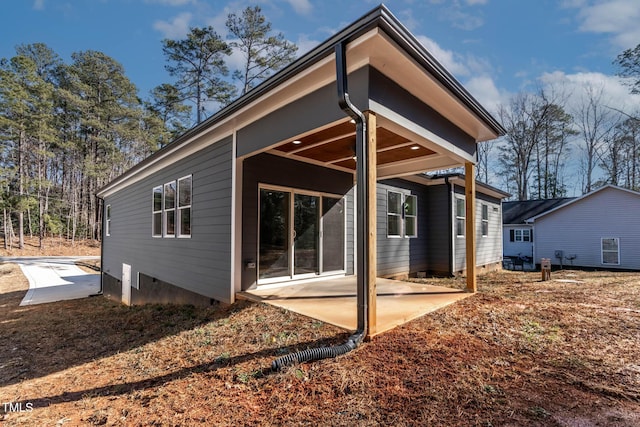 back of house with a patio area