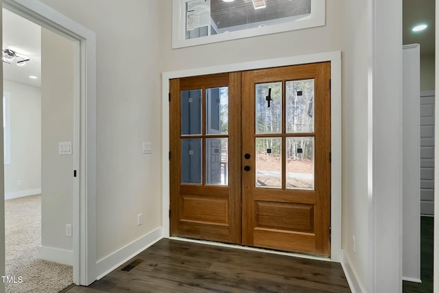 doorway to outside featuring dark hardwood / wood-style floors and french doors