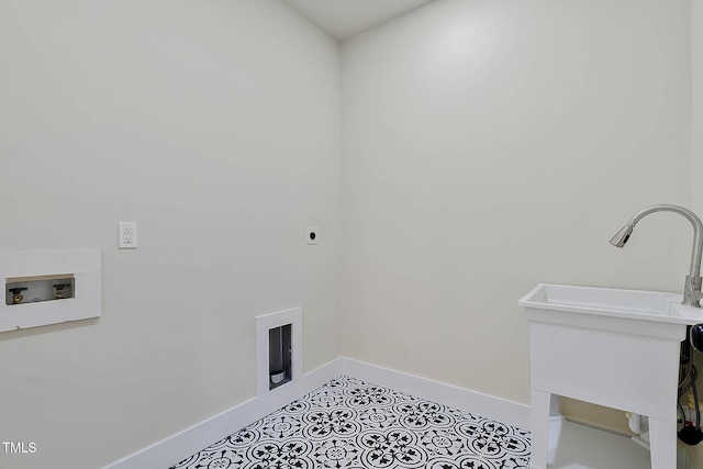 clothes washing area with washer hookup, light tile patterned floors, sink, and hookup for an electric dryer