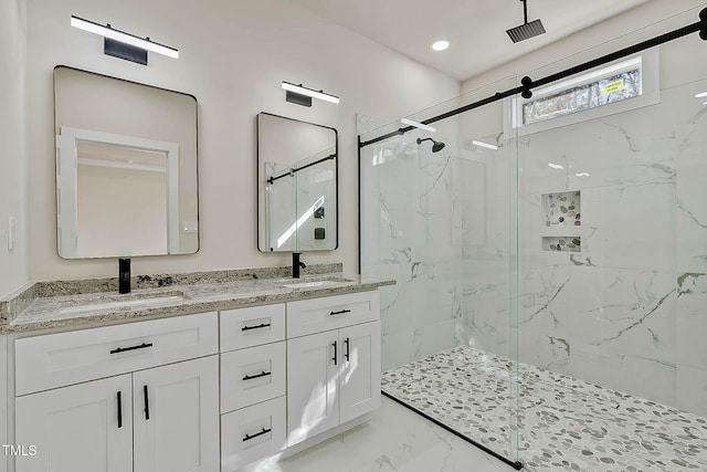 bathroom featuring vanity and an enclosed shower