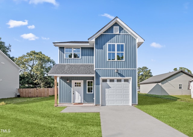 front of property with a garage and a front lawn