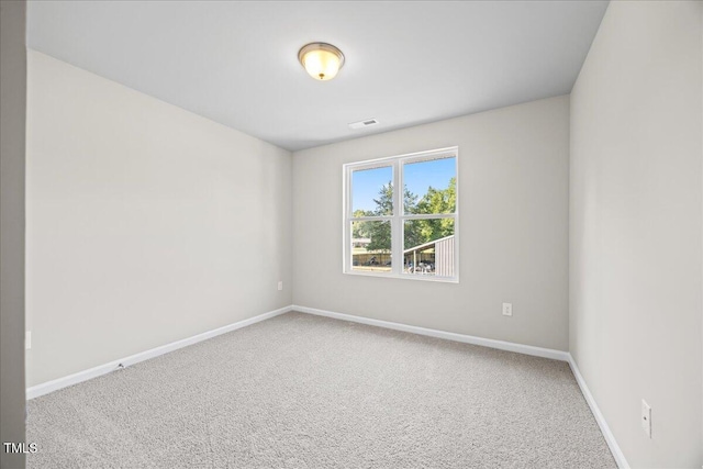 spare room featuring carpet floors