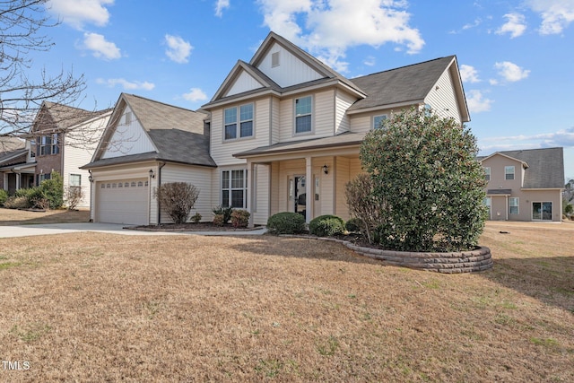 view of front of property featuring a front yard, covered porch, driveway, and an attached garage