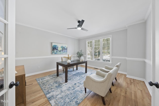 home office with crown molding, light hardwood / wood-style floors, and ceiling fan