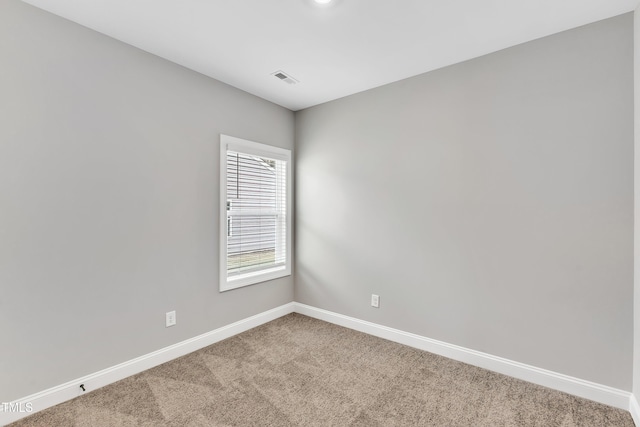 spare room featuring carpet floors