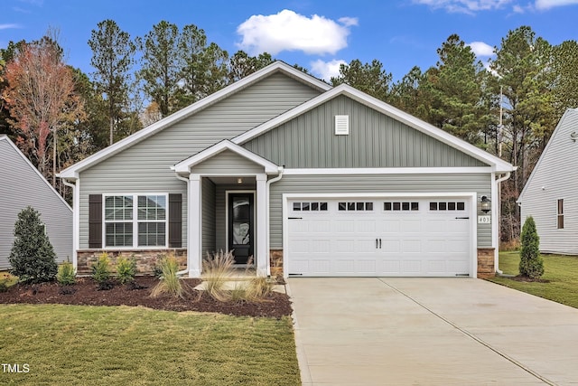 craftsman-style house with a garage and a front lawn