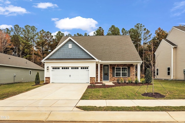 craftsman inspired home with a garage and a front yard