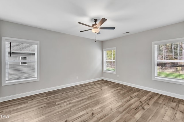 empty room featuring light hardwood / wood-style floors and ceiling fan