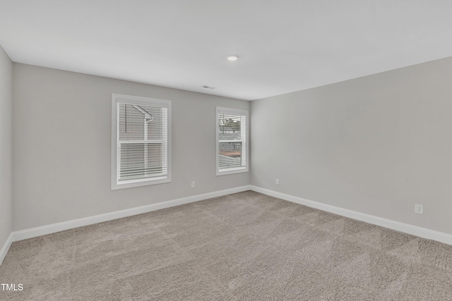 empty room with light colored carpet