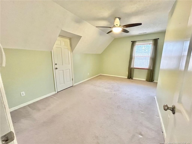 bonus room featuring vaulted ceiling, ceiling fan, and carpet flooring