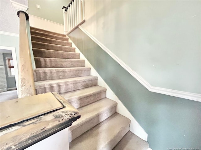 staircase with crown molding