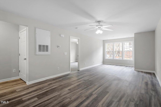 unfurnished living room with ceiling fan and dark hardwood / wood-style flooring