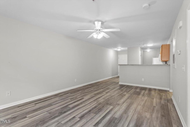 interior space with hardwood / wood-style floors and ceiling fan