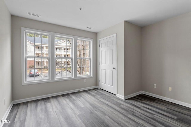 spare room featuring hardwood / wood-style floors