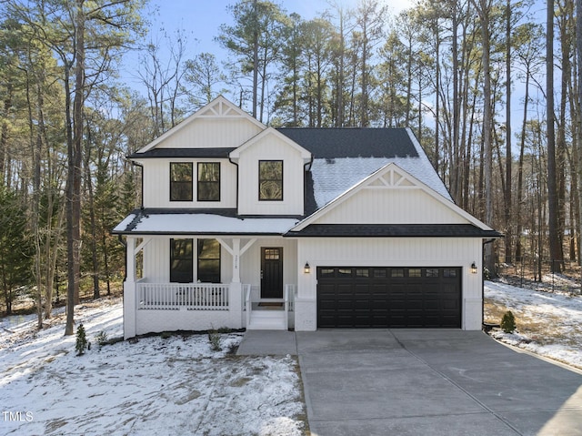 modern farmhouse style home with a garage and covered porch