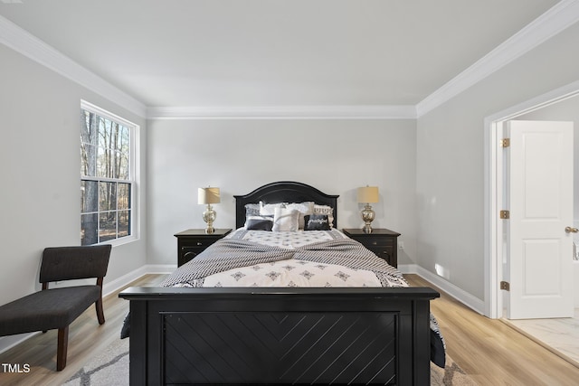 bedroom with ornamental molding and light hardwood / wood-style floors