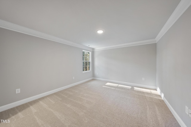 carpeted spare room with ornamental molding