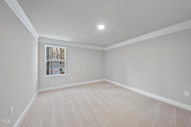 carpeted empty room with crown molding