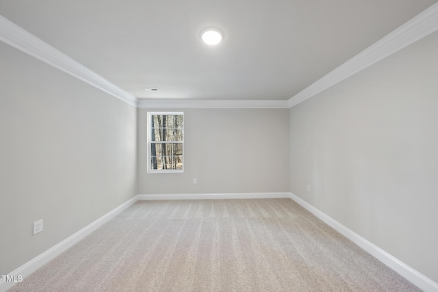 unfurnished room featuring light colored carpet and ornamental molding