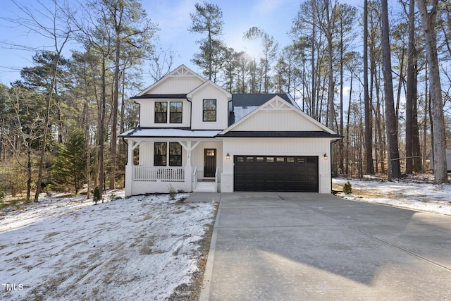 modern farmhouse style home with a porch and a garage