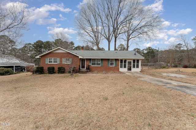 ranch-style home with a front lawn