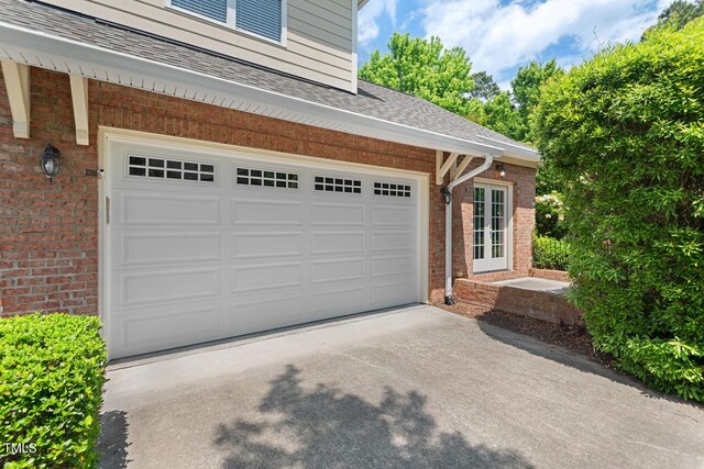 garage with concrete driveway