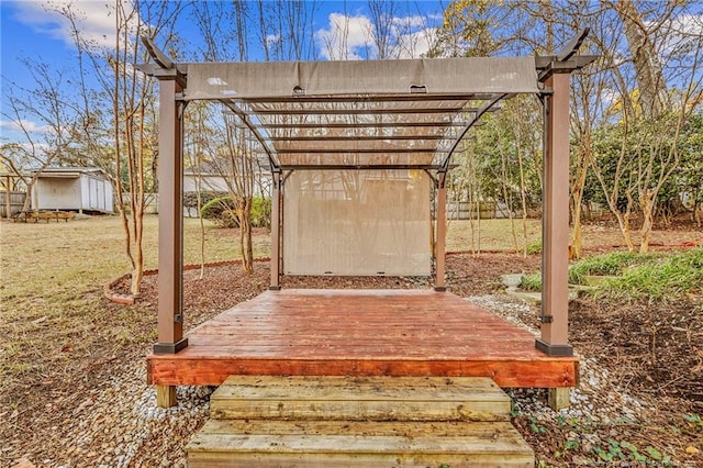 exterior space featuring a pergola and a wooden deck