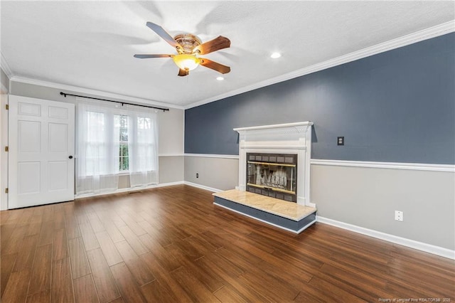 unfurnished living room featuring ceiling fan, dark hardwood / wood-style flooring, and crown molding