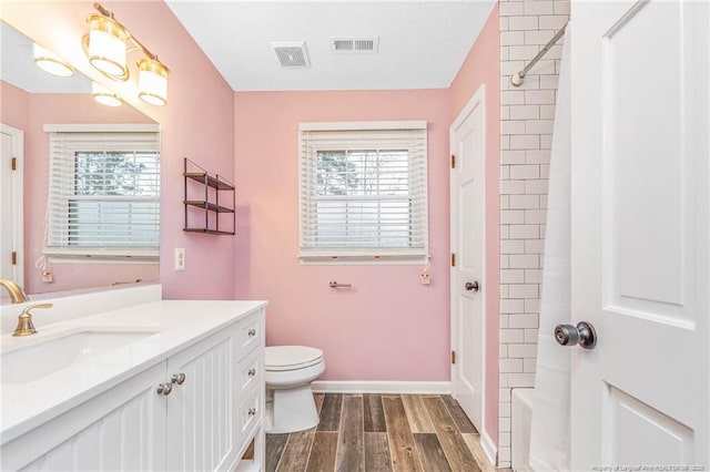 full bathroom with vanity, toilet, and bathing tub / shower combination