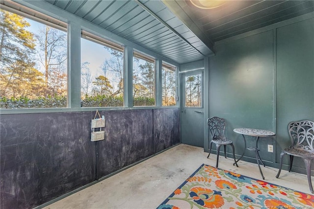 sunroom / solarium featuring a healthy amount of sunlight