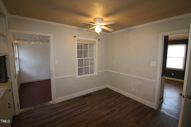 spare room featuring dark hardwood / wood-style floors, ceiling fan, and ornamental molding