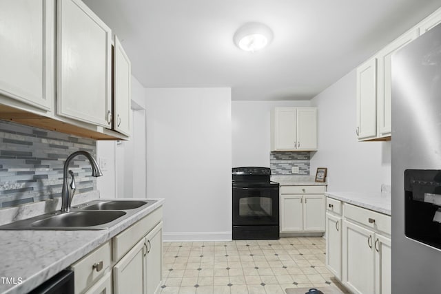 kitchen featuring sink, backsplash, white cabinetry, light stone counters, and black appliances