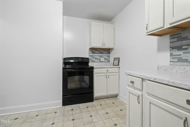 kitchen with white cabinets, black range with electric stovetop, light stone countertops, and tasteful backsplash