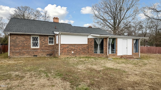 back of house featuring a lawn