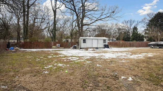 snowy yard with an outdoor structure