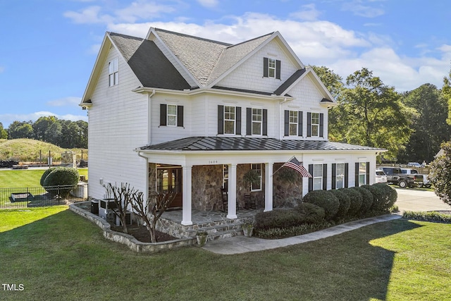 view of front of home featuring a porch and a front lawn