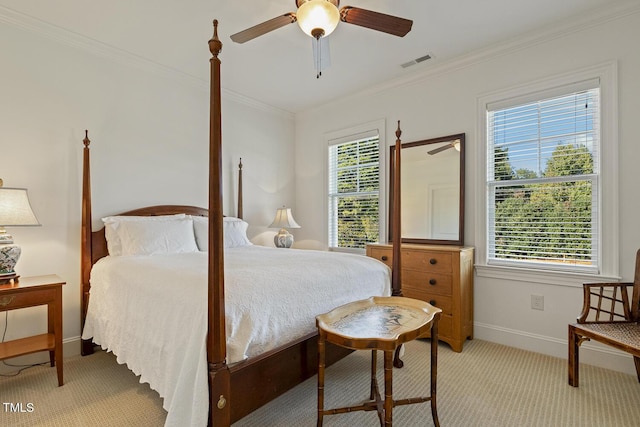 bedroom with multiple windows, crown molding, light carpet, and ceiling fan