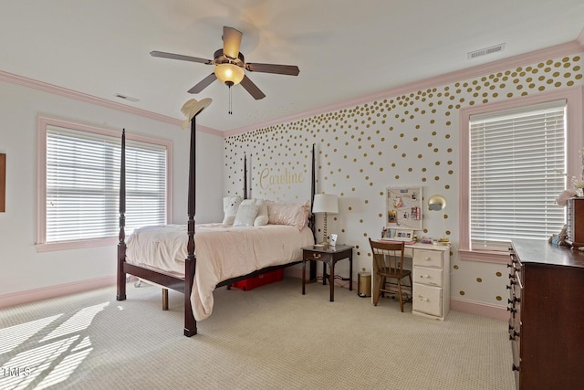 bedroom with crown molding, ceiling fan, and light carpet