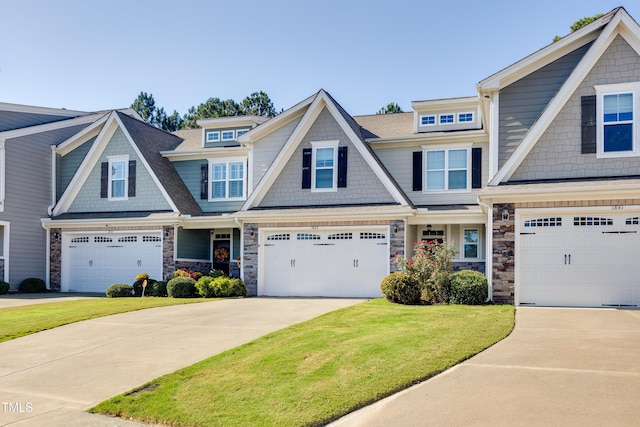 view of front of house featuring a garage and a front yard