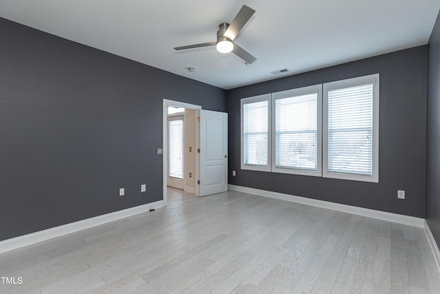 unfurnished room with ceiling fan and light hardwood / wood-style floors