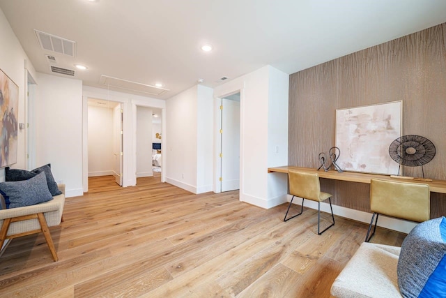 sitting room with light hardwood / wood-style flooring