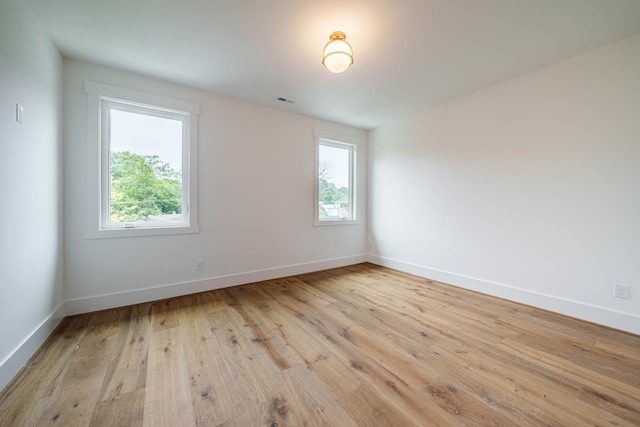 unfurnished room featuring light hardwood / wood-style floors