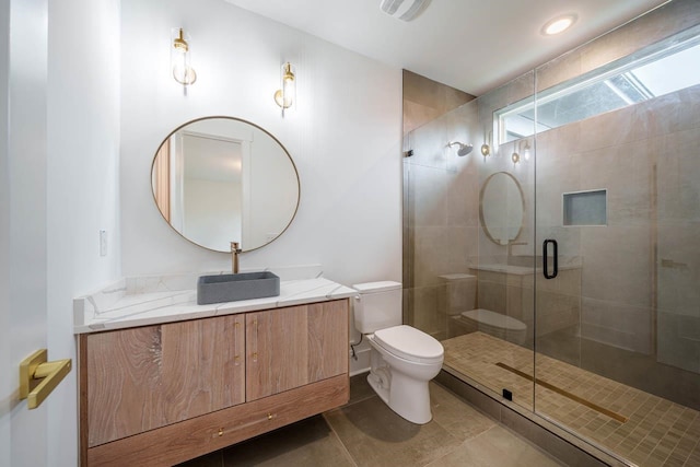 bathroom with walk in shower, tile patterned floors, vanity, and toilet